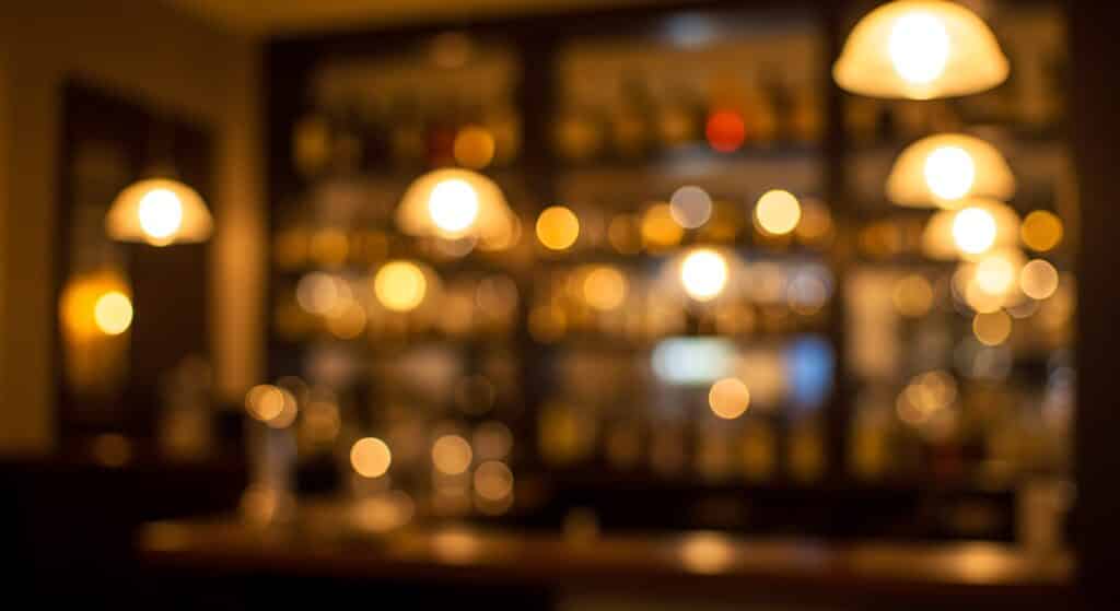 Wisconsin supper clubs are a fun way to spend your time in Wausau. Supper clubs have low lighting and dark wood furnishings, like this blurred restaurant image.