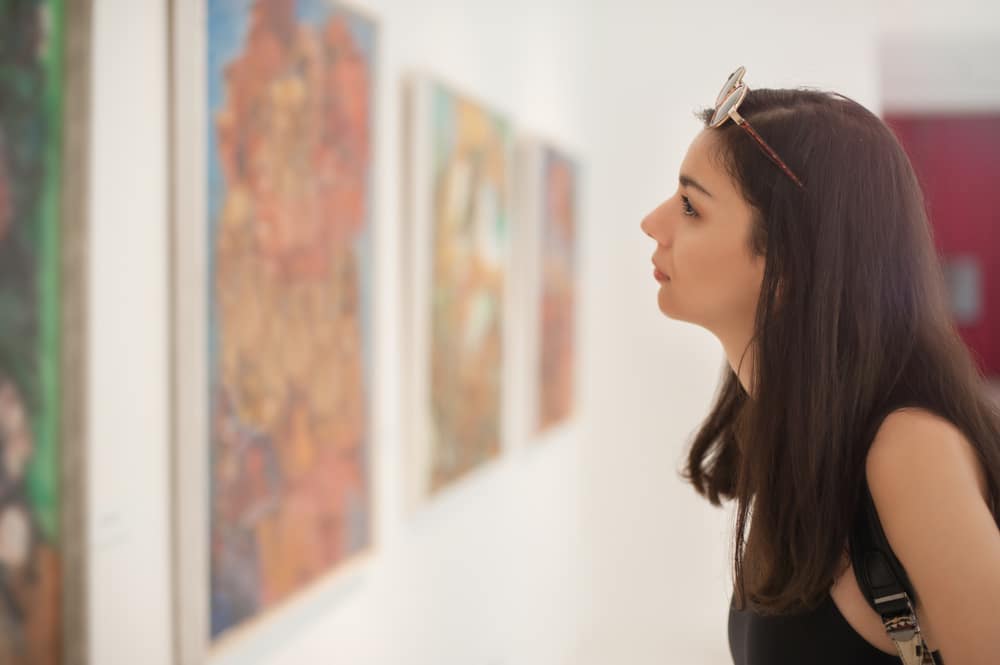 Don't Miss the Leigh Yawkey Woodson Art Museum 4 Woman studying one of the exhibits at the Leigh Yawkey Woodson Art Museum in Wausau