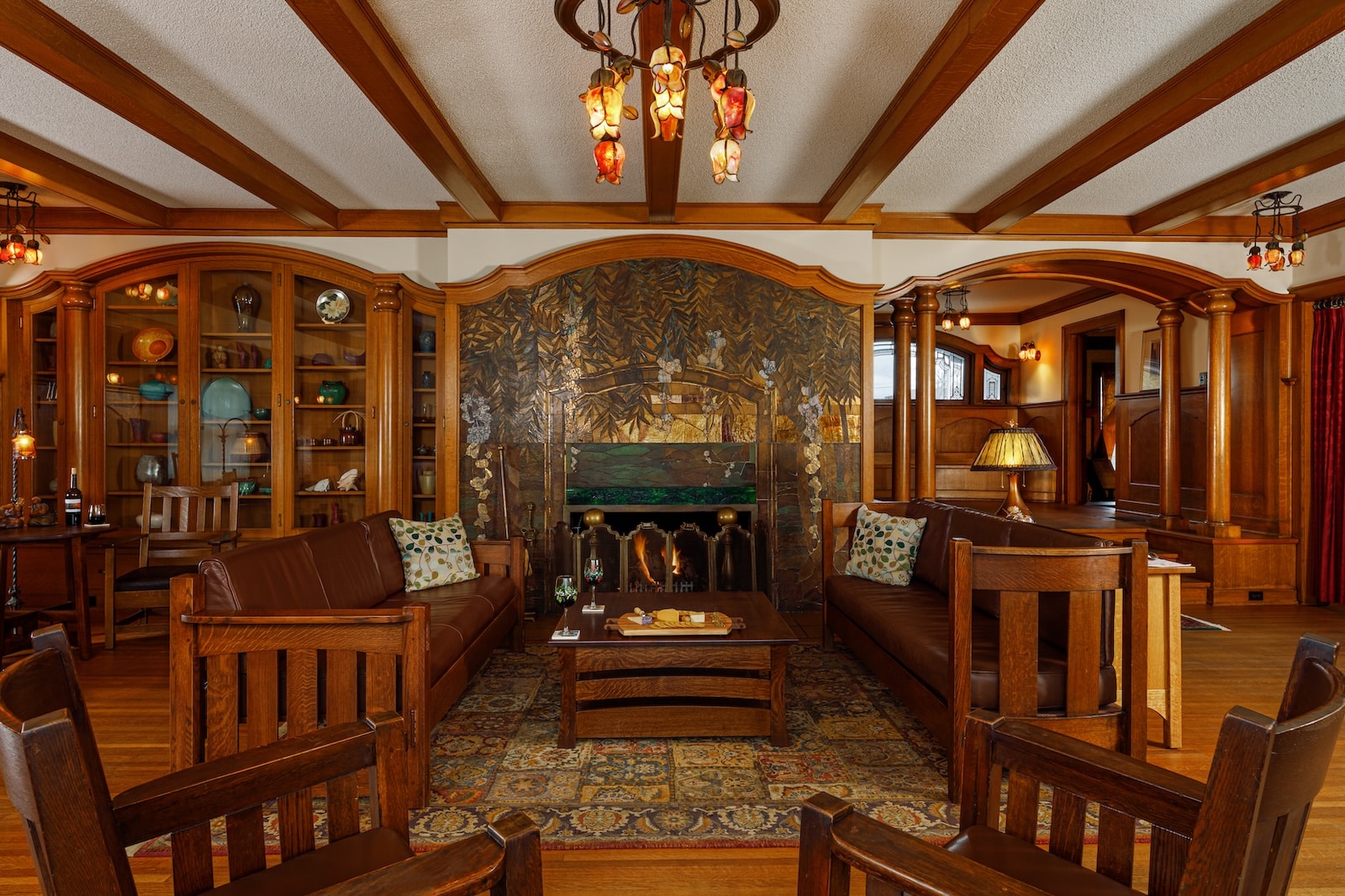 Inside the Timekeeper Distillery: Wausau's Craft Spirits Scene 4 The common room with wooden furniture at the Stewart Inn, one of the best hotels in Wausau, WI.